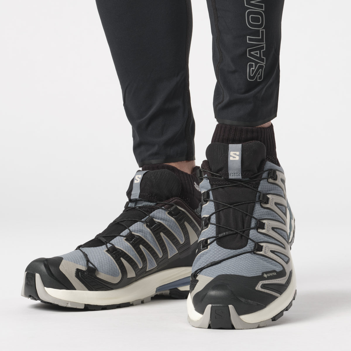 Salomon Sports XA PRO 3D V9 GORE-TEX hiking footwear showing rugged design and waterproof Gore-Tex material for outdoor adventures.