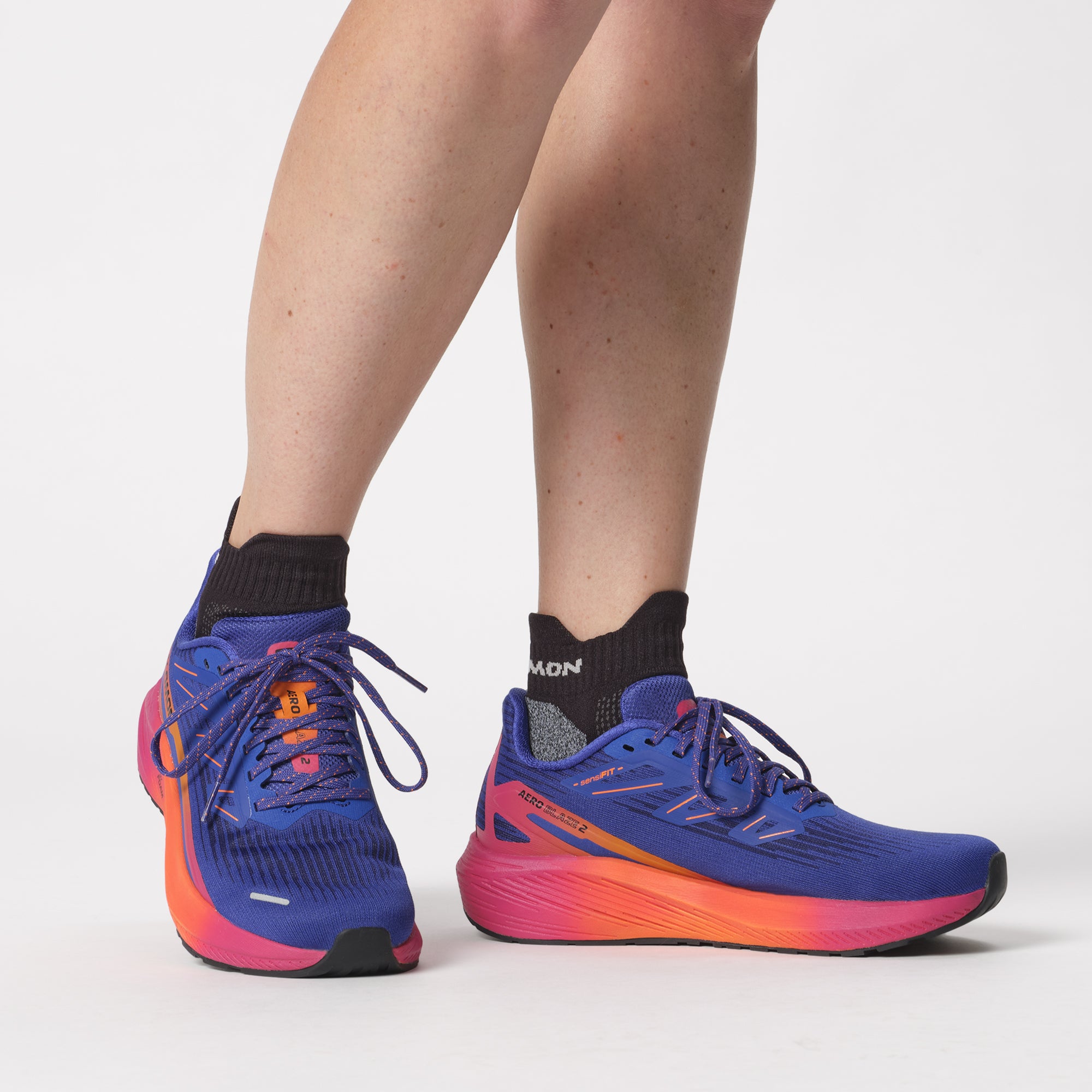 Salomon Sports Aero Blaze 2 athletic footwear, featuring sleek design and lightweight construction, shown in a close-up image.