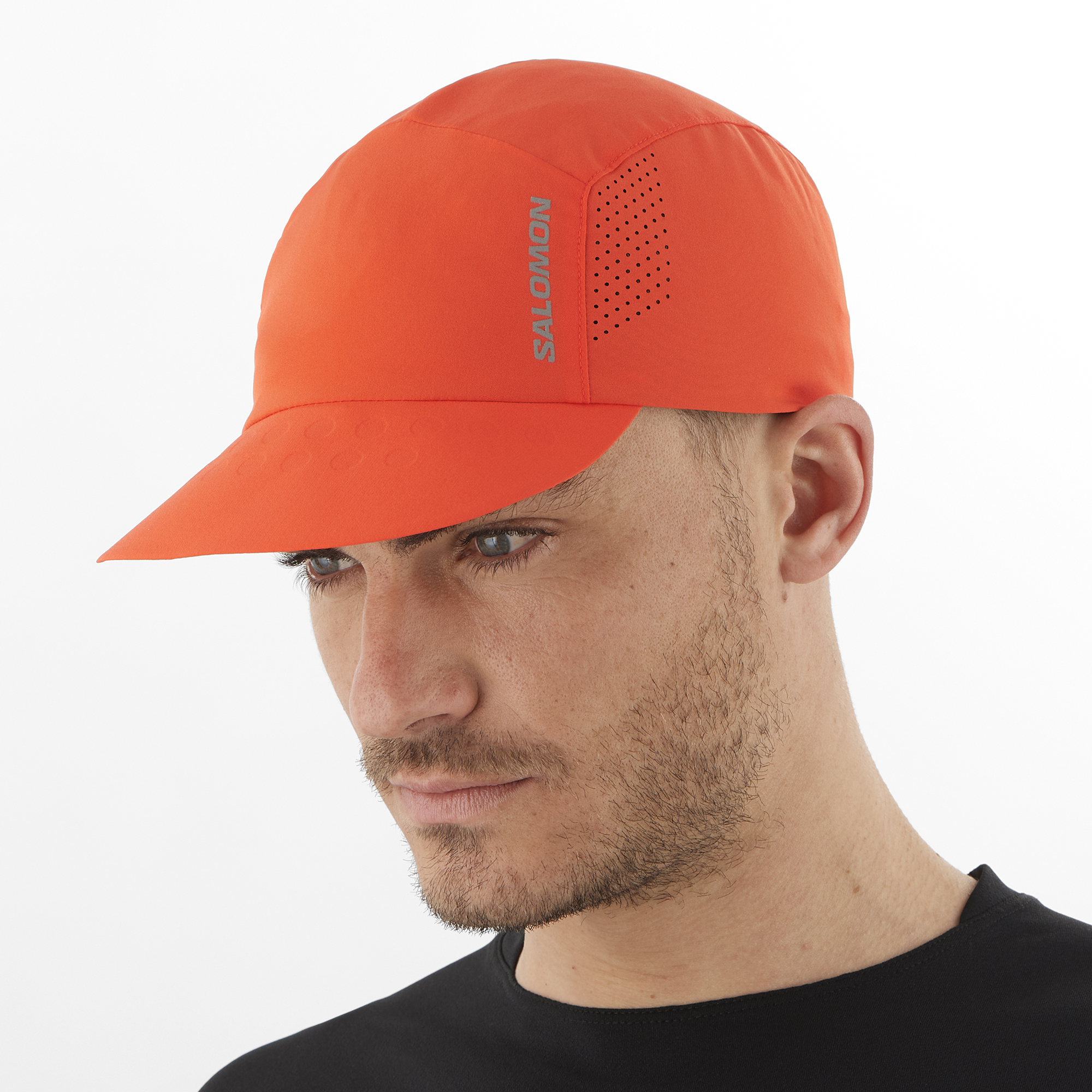 Salomon Sports Cross Compact accessories cap in cherry tomato color with adjustable fit and logo detail.