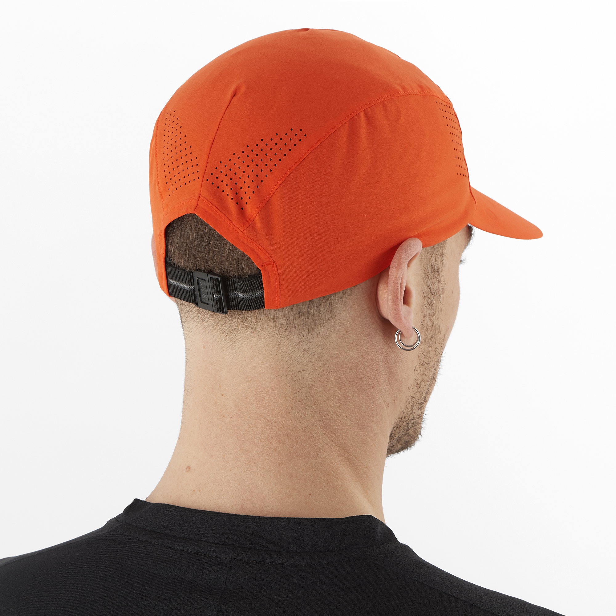 Salomon Sports Cross Compact accessories with cherry tomato-colored cap, stylish and functional outdoor gear.