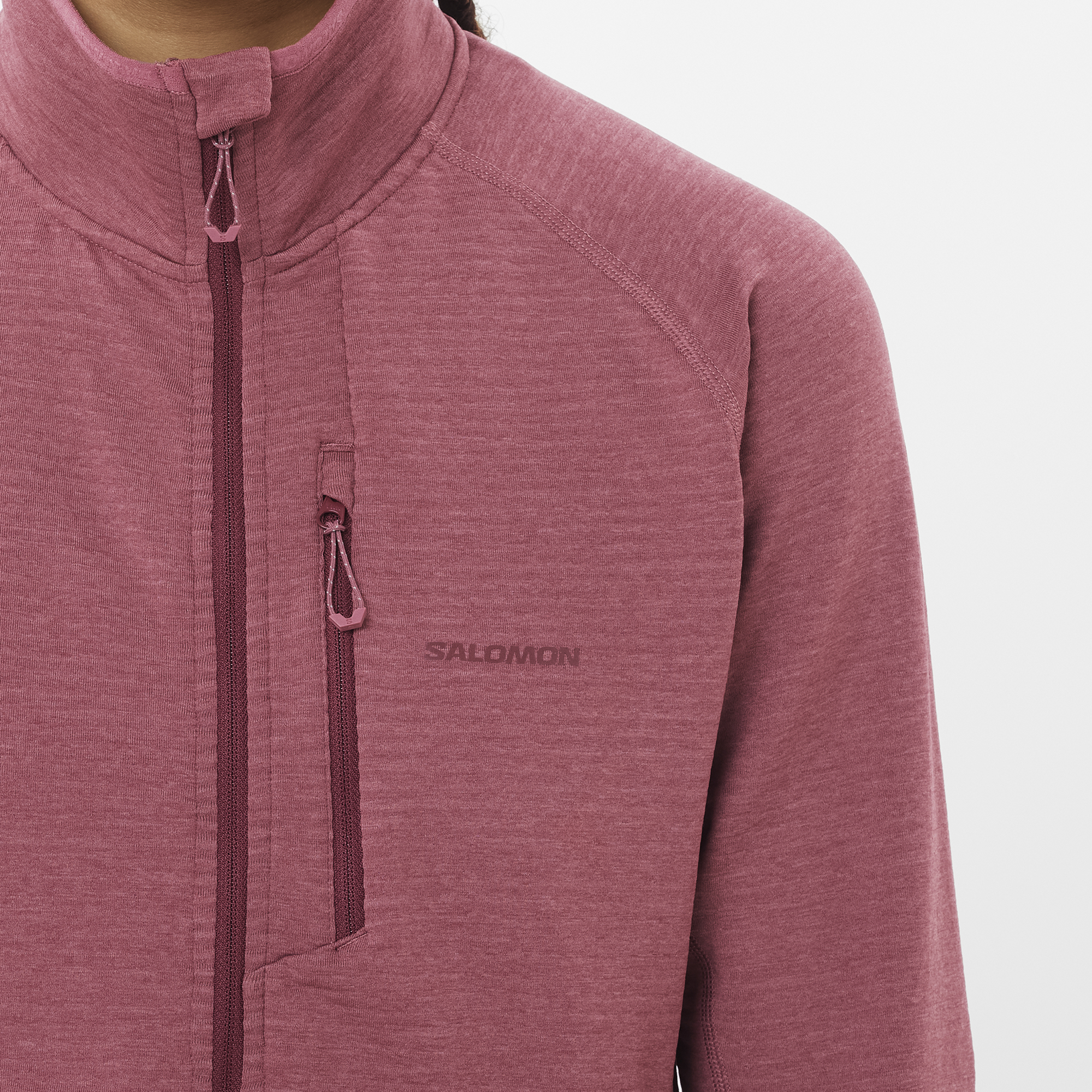 Salomon Sports Essential Lightwarm apparel in Nocturne color, shown on a hiker, designed for outdoor warmth and comfort.