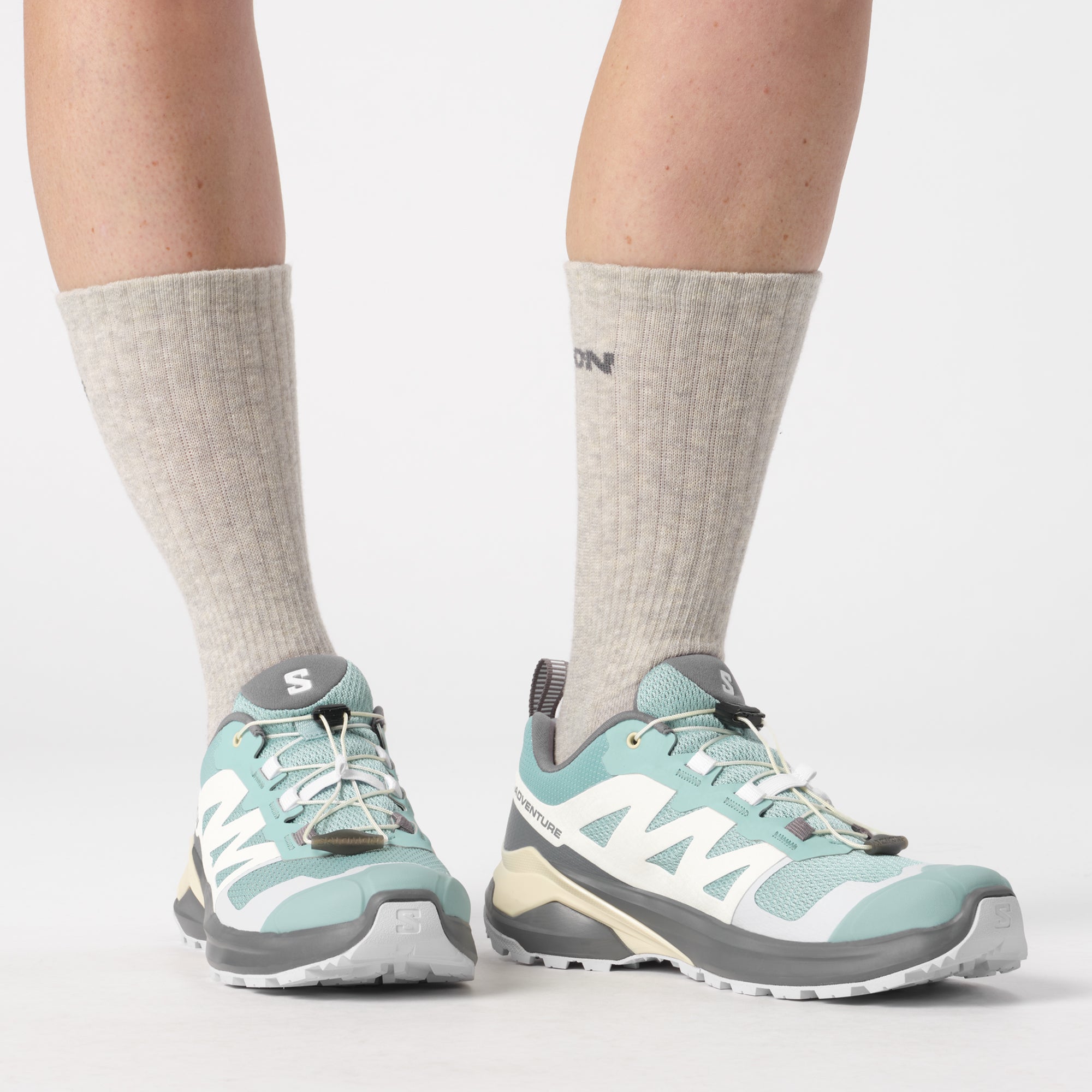 Salomon Sports X-Adventure footwear showing lightweight trail running shoes with breathable mesh and rugged outsole.