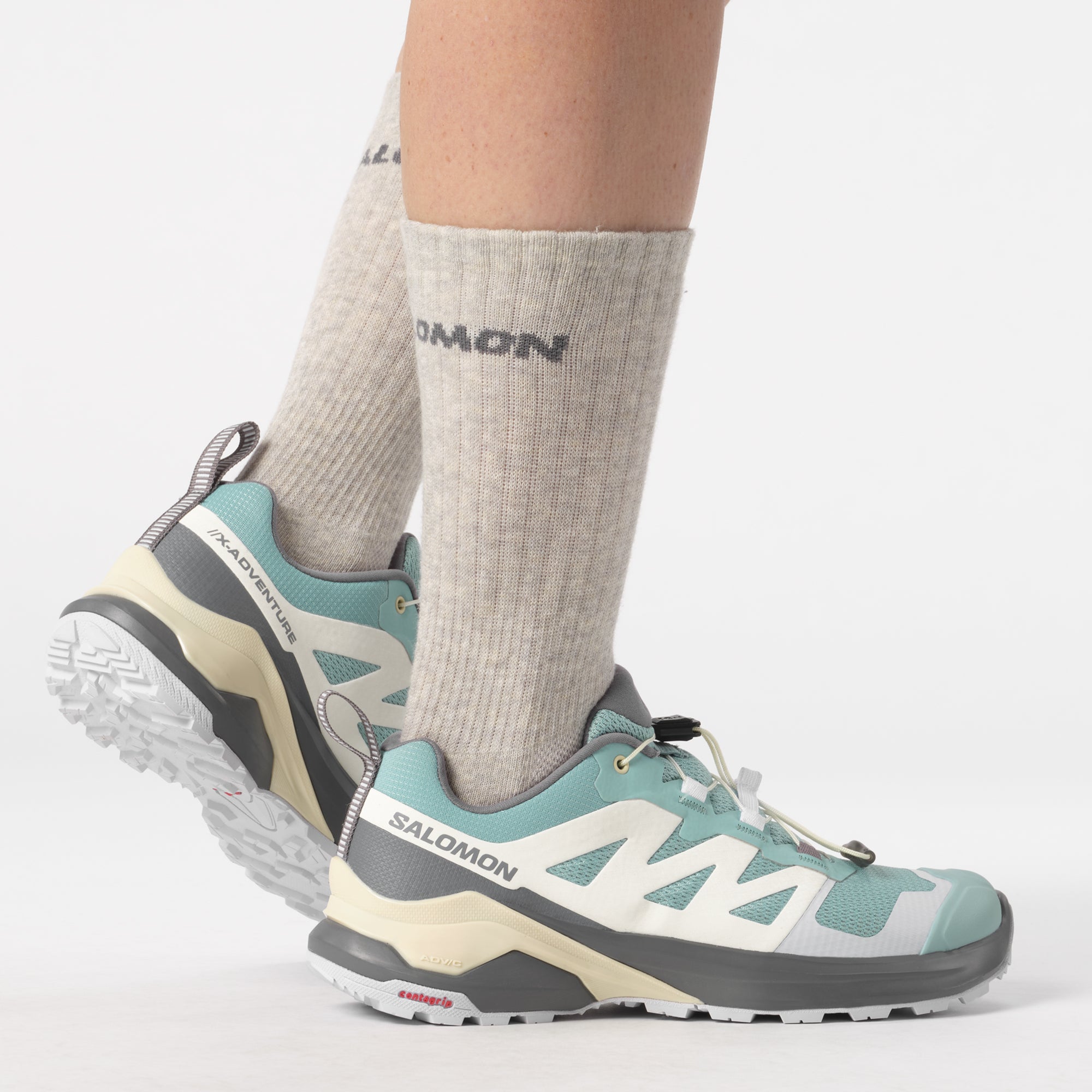 Salomon Sports X-Adventure footwear showing durable hiking shoes with rugged soles and breathable material for outdoor adventures.