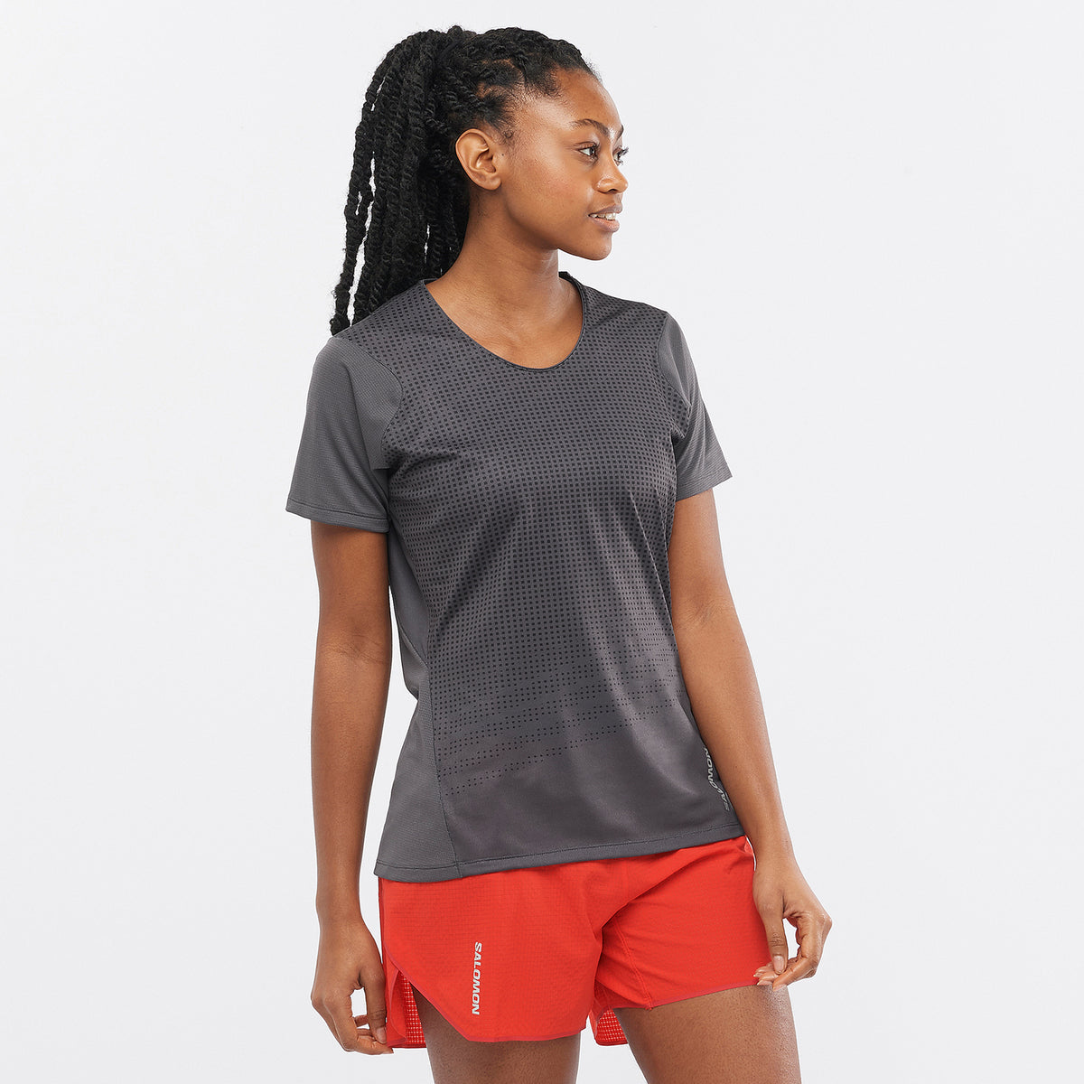 Salomon Sports SENSE AERO apparel, lightweight and breathable sports clothing, shown in black with sleek design.