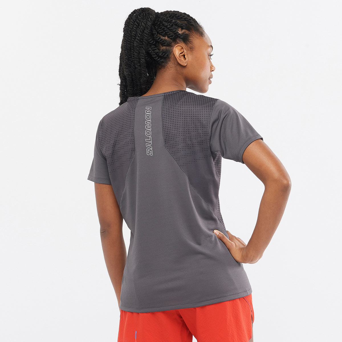 Salomon Sports SENSE AERO apparel, lightweight and breathable activewear top, shown in a close-up image.