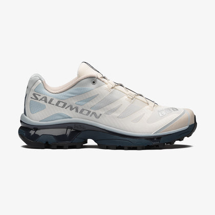 Salomon Sports XT-4 OG footwear showing black and red trail running shoes with rugged design and breathable mesh upper.